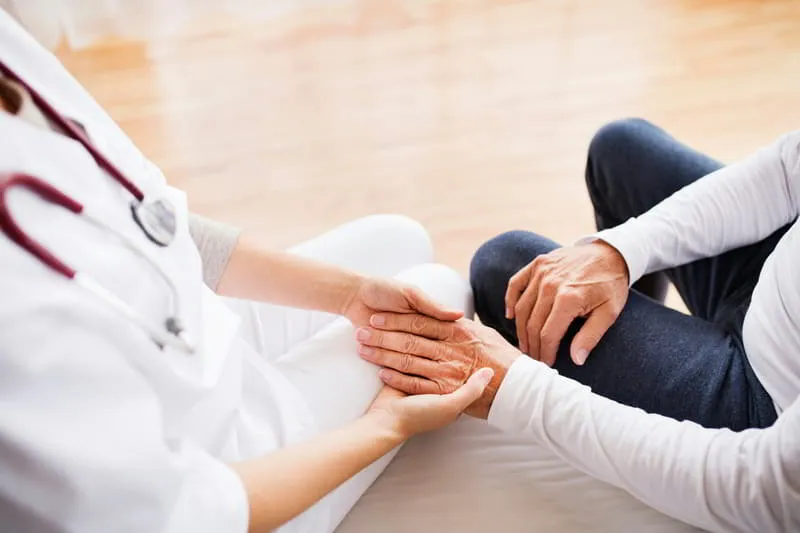 Patient and caregiver in a supportive healthcare setting