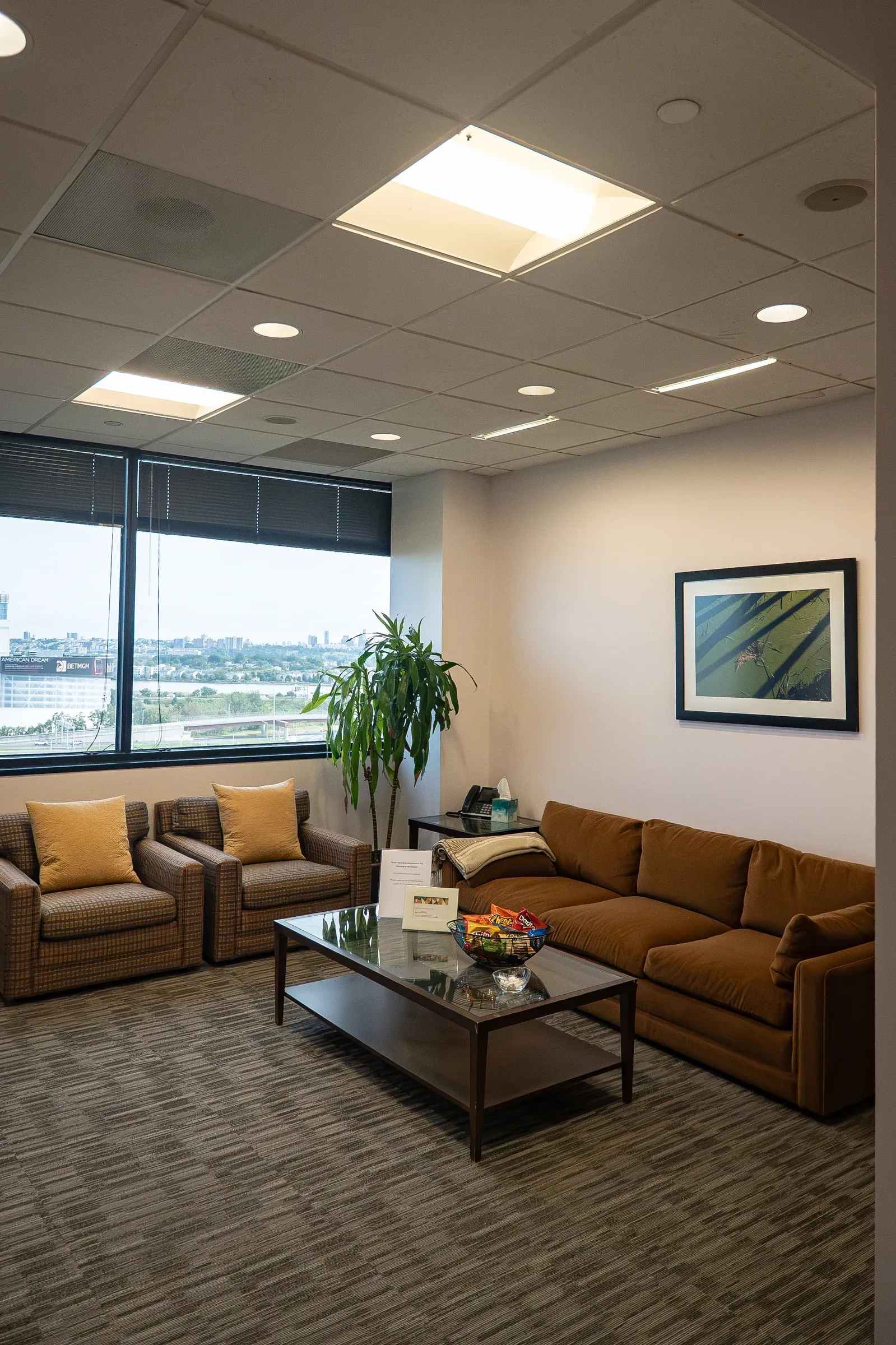 Highlands Suite private lounge with sofa and armchair seating